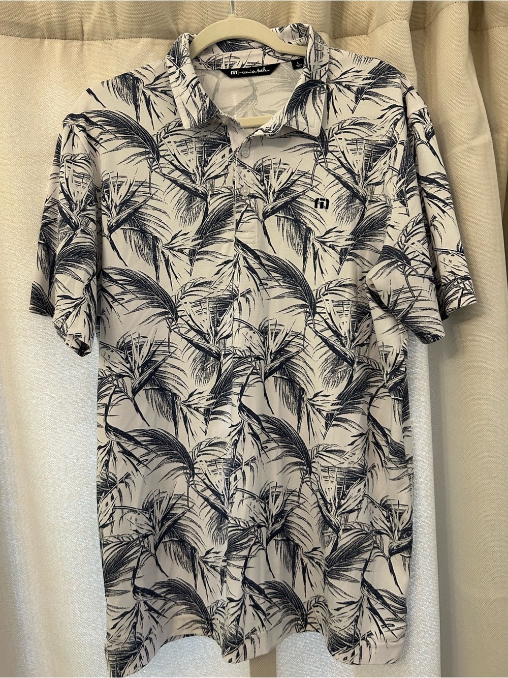 Travis Mathew White Polo with Navy Tropical Palm Print